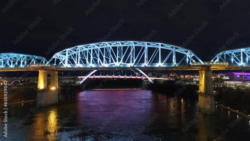 Aerial Forward Shot Of Illuminated Bridges Over River Against Sky At Night - Nashville, Tennessee Aerial Forward Shot Of Illuminated Bridges Over River Against Sky At Night - Nashville, Tennessee