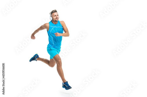 The jogger ran at sport training isolated on white, banner. In a morning sport workout jogger run in studio. The jogger stretched legs before running. sport jogger listen to music in headphones © be free