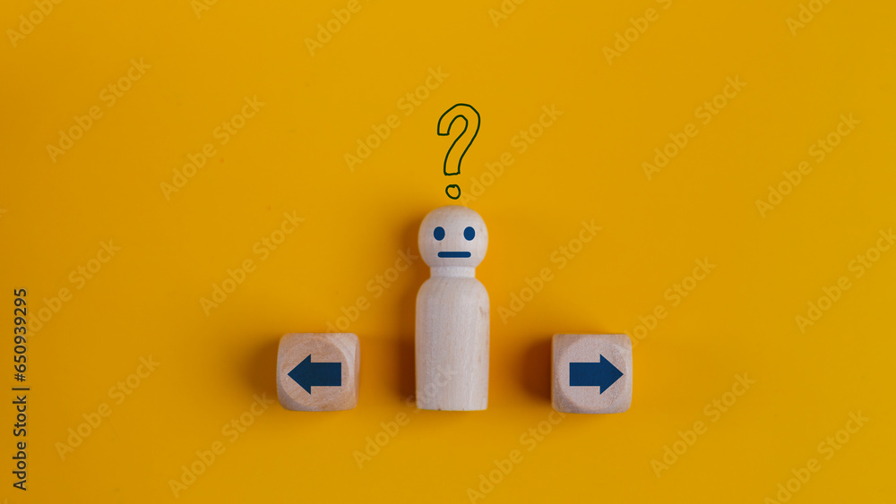 Stockfoto A wooden man with question marks standing in between the