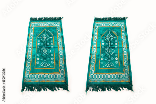 photo of green prayer mat isolated on white background