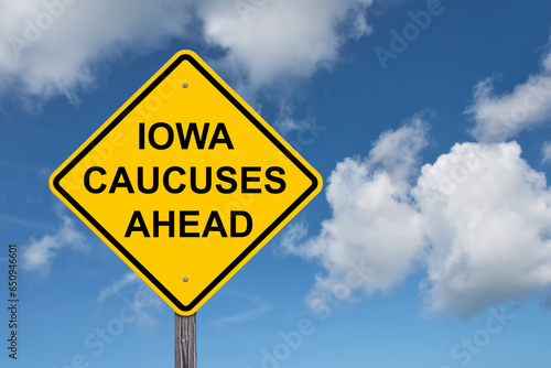 Iowa Caucuses Ahead Caution Sign Blue Sky Background photo