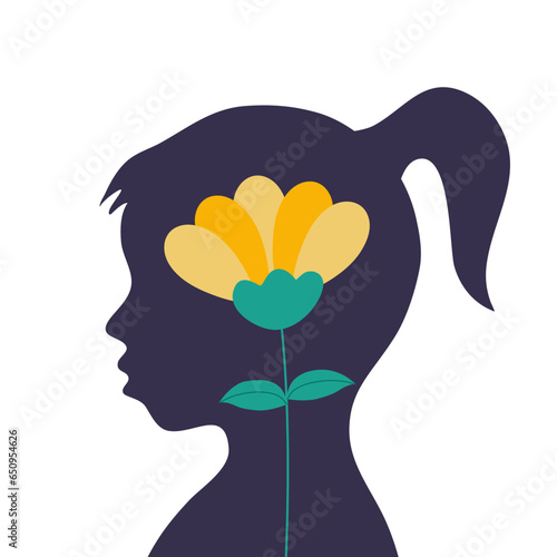 A silhouette of girl child with flower inside. Kid mental health concept.