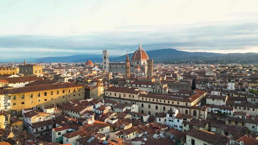 Forwards fly above the streets and buildings of Florence city, Cathedral (Duomo di Firenze) at sunset, Tuscany, Italy Forwards fly above the streets and buildings of Florence city, Cathedral (Duomo di Firenze) at sunset, Tuscany, Italy