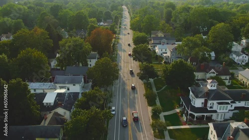 Drone shot  following cars of Downtown Palmyra New York. Also the location of the first publication of the Book of Mormon.  Early church history. 60fps early 1800s photo