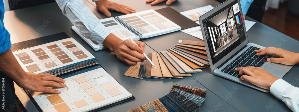 Group of interior architect designer team at table choosing various ...