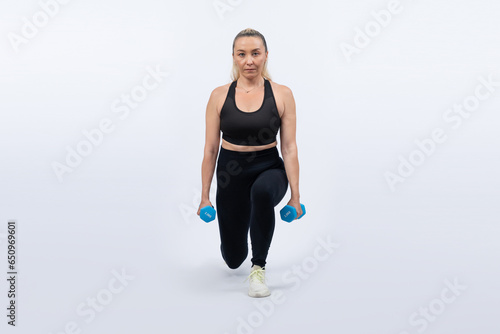 Full body length shot active and sporty senior woman lifting dumbbell during weight training workout on isolated background. Healthy active physique and body care lifestyle for pensioner. Clout © Summit Art Creations