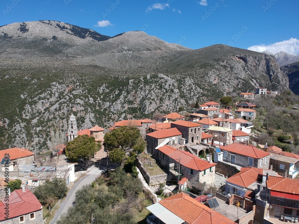 Aerial view over the old traditional stoned buildings and houses in Vorio village located near Kentro Avia and Pigadia Villages in Mani area, Taygetus Mount, Messenia, Greece