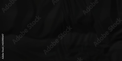 Dark crumple black paper wrinkled poster template ,blank glued creased paper texture background. black paper crumpled backdrop background. used for cardboard and clarkboard.