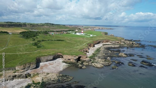 Aerial drone shot of Souter Lighthouse and sea coastline Sunderland North East England. South Sheilds, Marsden and Whitburn. Drone remains static. 4K