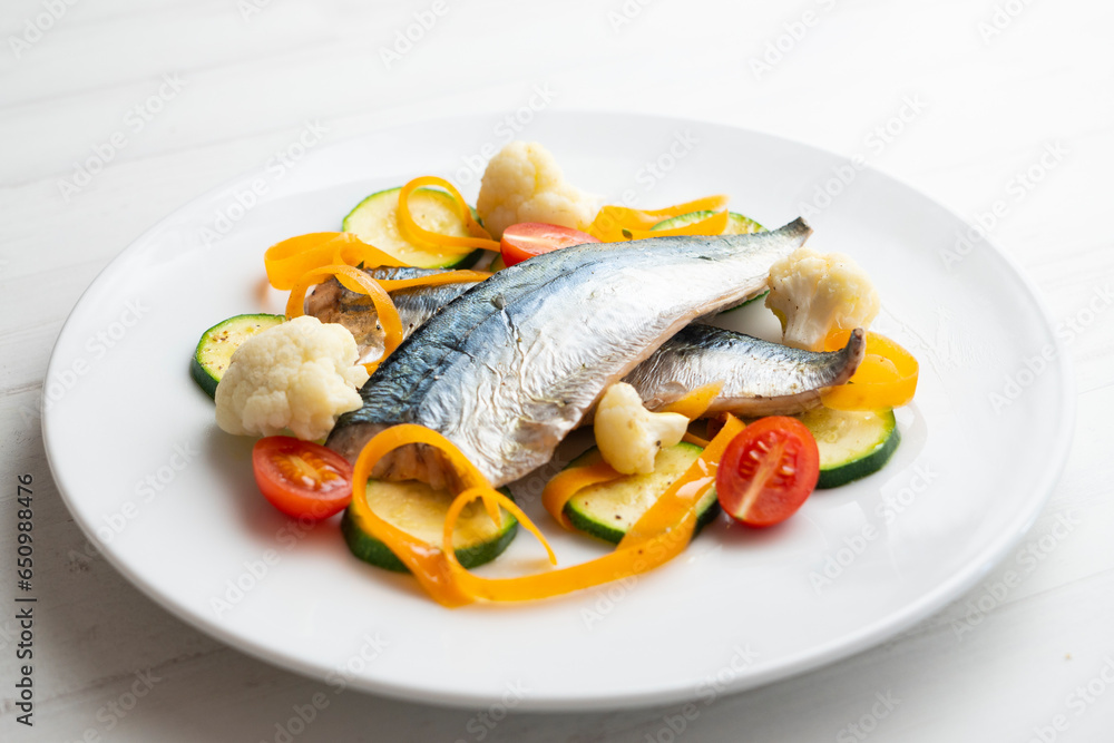 Steamed mackerel with cauliflower and other seasonal vegetables.