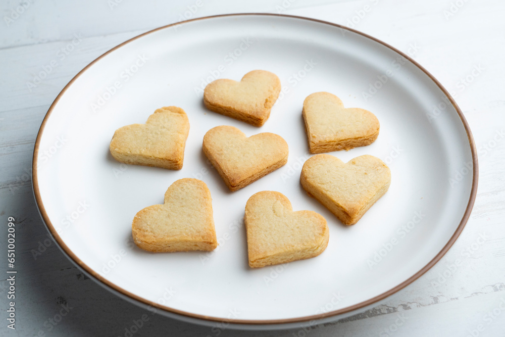 Preparing butter cookies for children with star and heart shapes. Preparing butter cookies for children with star and heart shapes.