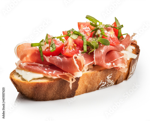 Crusty white bread sandwich with jamon serrano and basil close-up on neutral background.