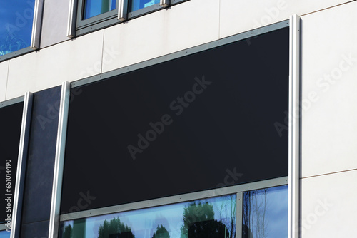 Blank black restaurant or shop signboard copy space mockup, clear signboard banner on a storefront mock up template for business logo and branding. photo