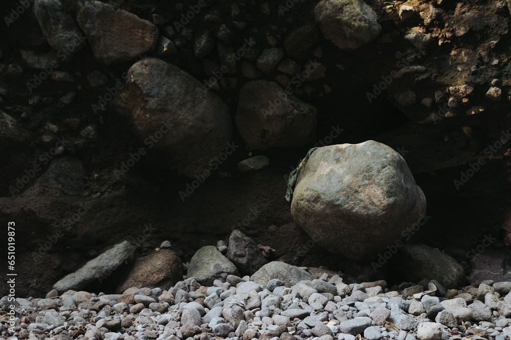 Large rocks formed by river flow visible after the water dries up Large rocks formed by river flow visible after the water dries up