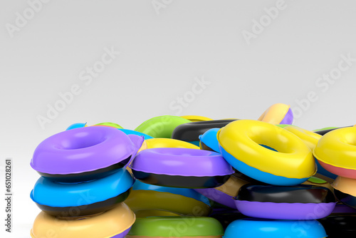Pile of inflatable ring for swimming pool isolated on white background