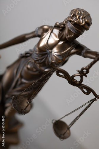 Lady Justice and law books in court