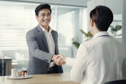Portrait of Smiling Businessman Greeting Client in Office, Happy Manager Discussing with Partner, Recruiting Job Interview