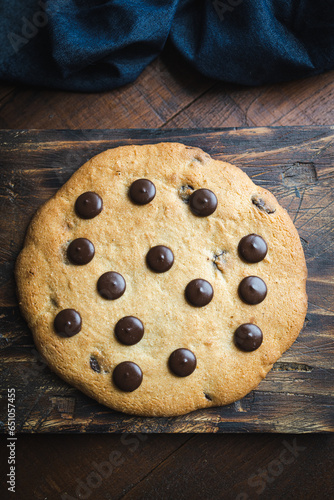 Giant chocolate chips cookie. Large and delicious homemade cookie with chunks of dark chocolate. The perfect breakfast or snack for those with a sweet tooth