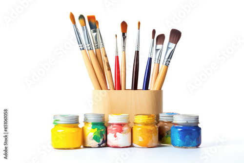 Paintbrushes and paints, isolated and ready for use, represents the essential equipment for artistic education and the exploration of color and craft.