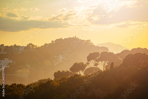 Stunning Spanish coastline at dusk in a warm yellow light