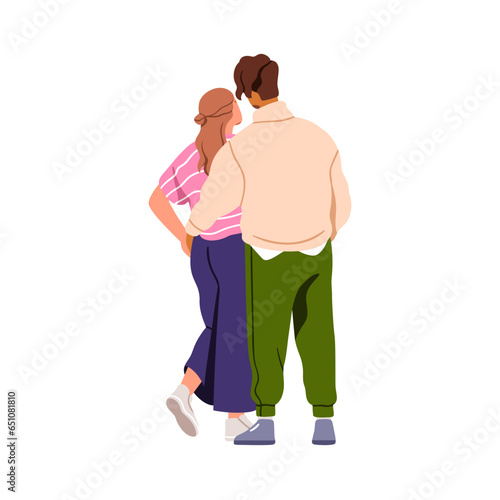 Romantic couple hugging from behind, back view. Young man and woman standing,...