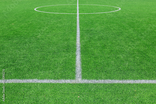 Green synthetic grass sports field with white line shot from above. background © unairakstudio