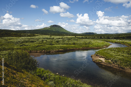 Landscape shot of Stor-Mittåkläppen with a meandering river in front of it