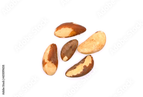 Brazil nuts isolated on white background. Group of delicious tasty healthy ripe shelled Brazil nuts. Eco product. Top view. Selective focus.