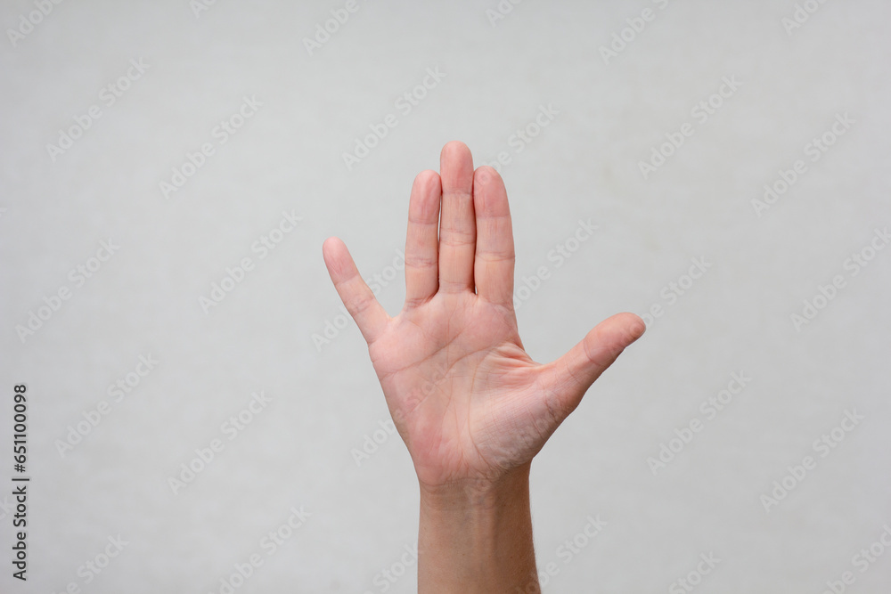 Woman hand showing position of three middle fingers how to selfexam