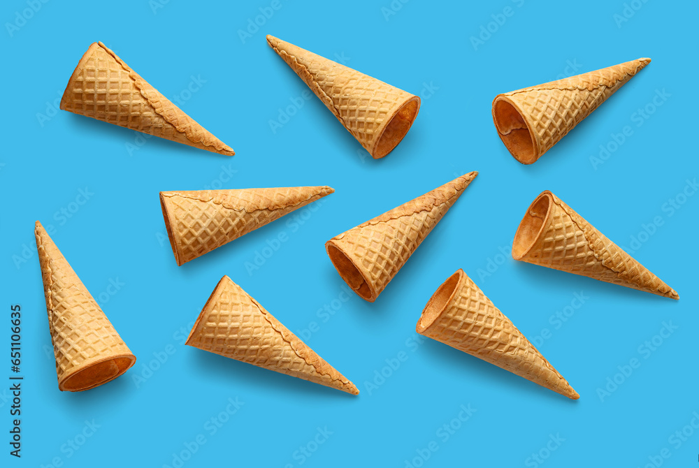 Ice cream cones on blue background. Top view, flat lay Ice cream cones on blue background. Top view, flat lay