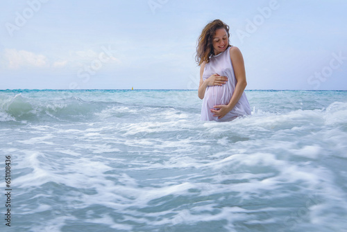 Pregnant woman and sea