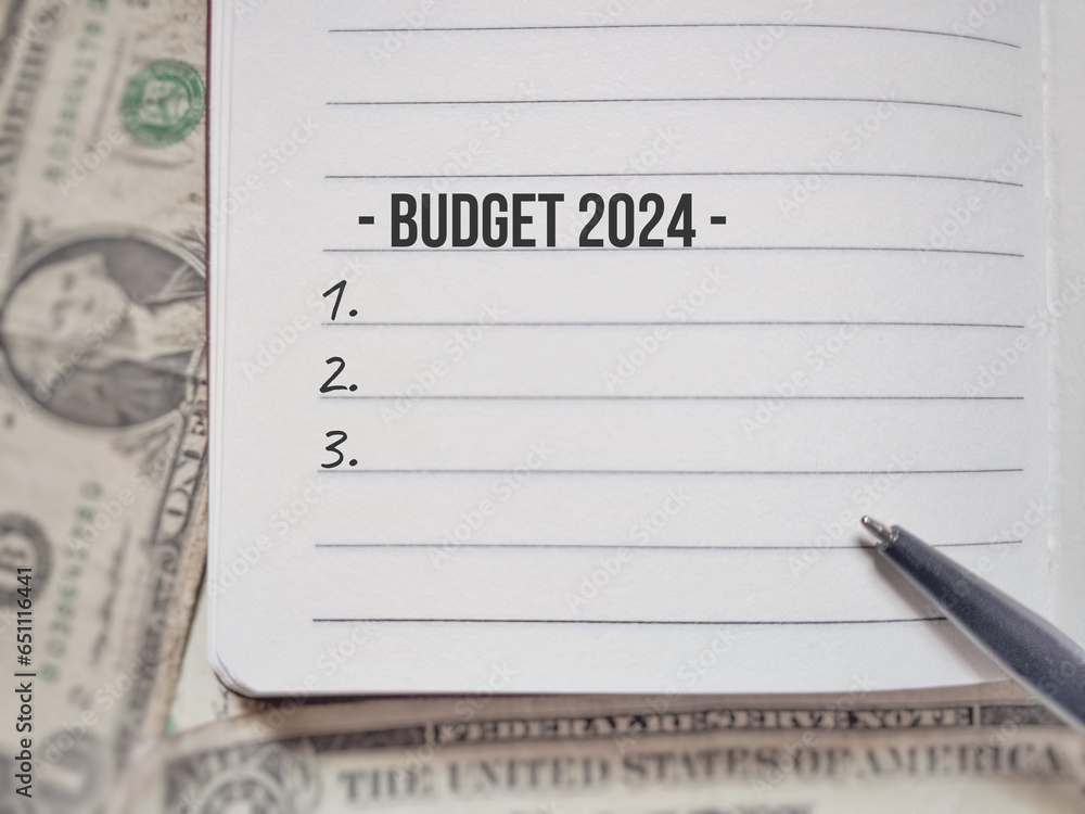 Finance and Economy Concept. Budget 2024 text on book background. Finance and Economy Concept. Budget 2024 text on book background.