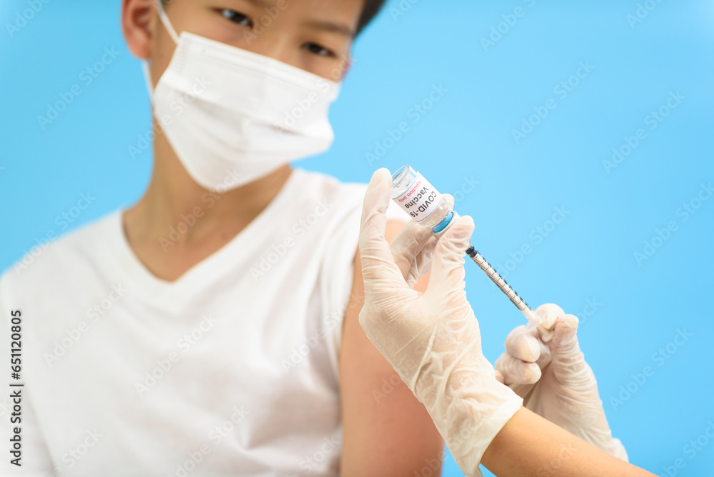 Vaccination in young Asian boy Vaccination in young Asian boy