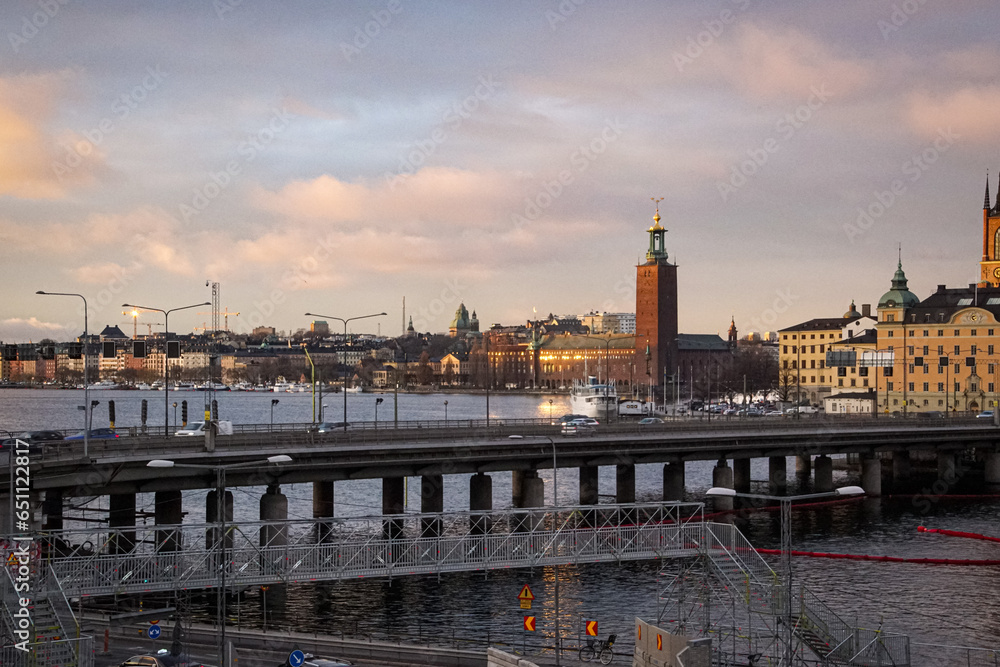 Fototapeta premium A bridge over river in city during evening