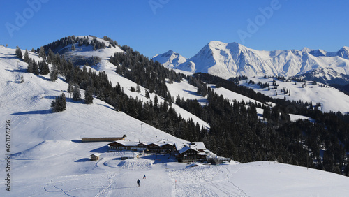 Horneggli Berghaus and ski slopes. Winter scene near Gstaad, Switzerland. photo
