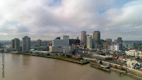 Wallpaper Mural Aerial Forward Shot Of Mississippi River Near Buildings And Vehicles In City Against Cloudy Sky - New Orleans, Louisiana Torontodigital.ca