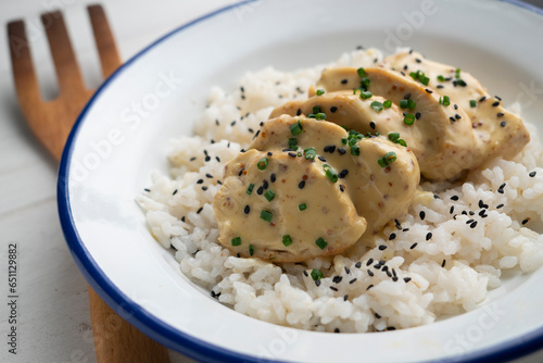 Chicken cooked with honey mustard sauce served over white rice.