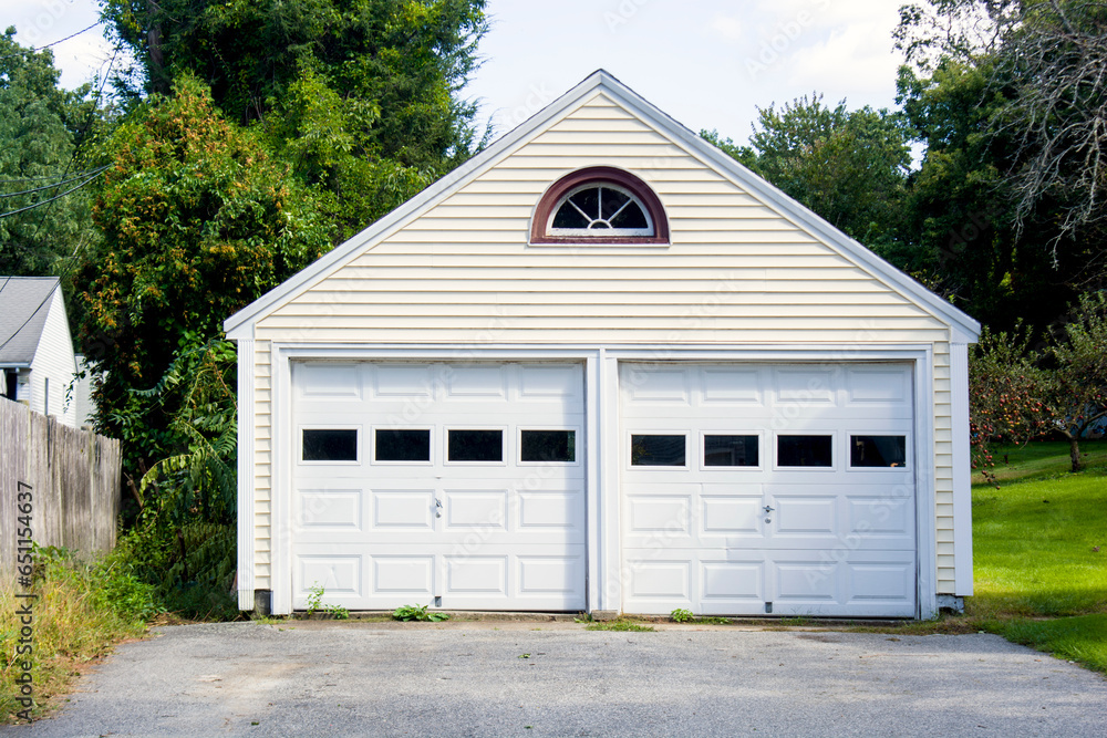Obraz premium Two Car Garage build as a single house with doors and windows
