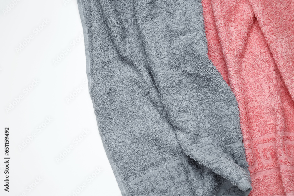 Soft and fluffy bath towel on white background. Top view, flatlay, copy space Soft and fluffy bath towel on white background. Top view, flatlay, copy space