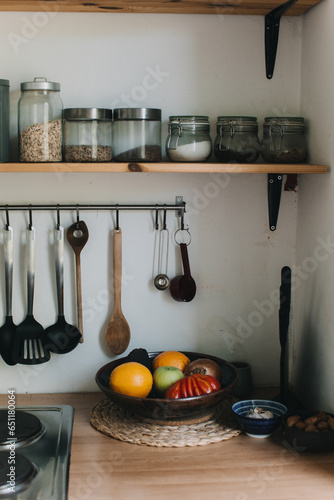 wooden rustic kitchen table. minimalistic interior, utencils on the table