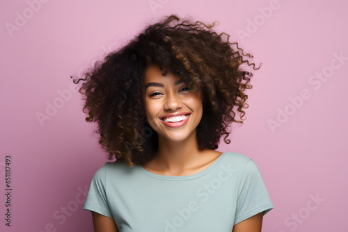 Portrait of beautiful smiling African American woman isolated on background © Oksana