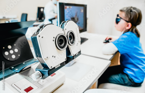 Hardware laser children vision treatment equipment. Laboratory device, medical office in hospital. Visual acuity, strabismus improvement. Advanced science correction.Pediatric ophthalmology procedure