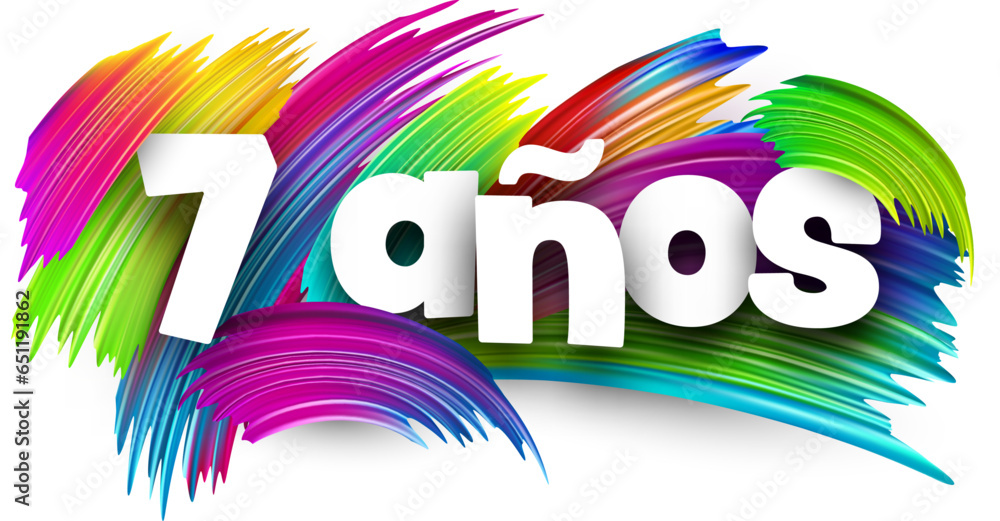 7 years at spanish paper word sign with colorful spectrum paint brush strokes over white. 7 years at spanish paper word sign with colorful spectrum paint brush strokes over white.