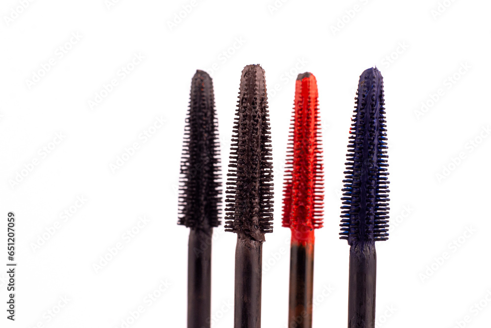 Colorful mascara brushes close up on white isolated background. Mascara brushes macro image. Colorful mascara brushes close up on white isolated background. Mascara brushes macro image.