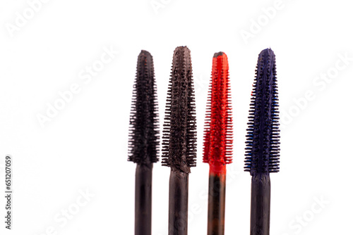 Colorful mascara brushes close up on white isolated background.  Mascara brushes macro image.