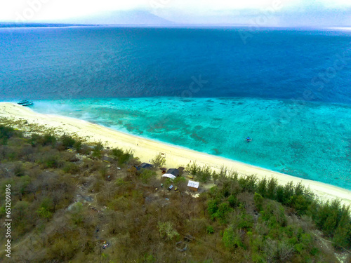 Aerial photo of Pulau Tabuhan, Banyuwangi. White sand beaches and crystal clear waters. photo