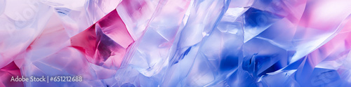 A close-up abstract background of a collection of blue and pink transparent crystals arranged in a chaotic manner, with no discernible pattern. Dreamy and ethereal mood.