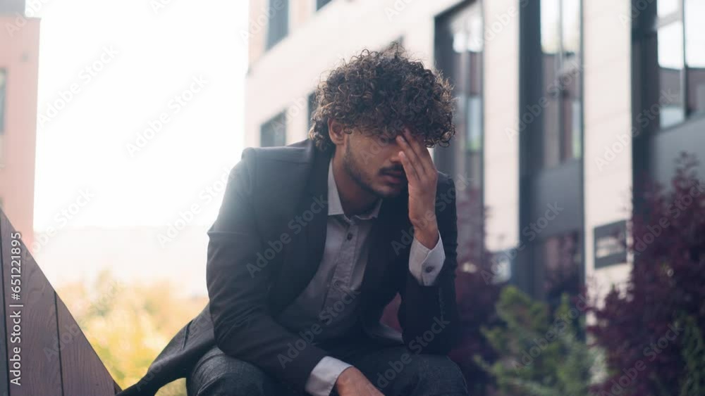Tired worried stressed Indian businessman feel bad unwell upset Arabian business man anxiety exhausted stress despair employer in city outdoors feeling headache migraine suffering work job problem Tired worried stressed Indian businessman feel bad unwell upset Arabian business man anxiety exhausted stress despair employer in city outdoors feeling headache migraine suffering work job problem