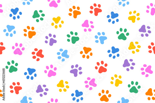 Fun colorful dog paw doodle seamless pattern. Puppy footprint in rainbow color pattern.
