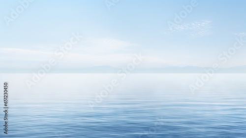  a large body of water with mountains in the distance and a blue sky. generative ai